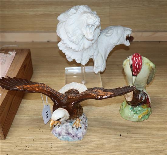 A Royal Doulton Art is Life limited edition group of a lion and lioness, with stand, a Beswick Bald Eagle and a Woodpecker,